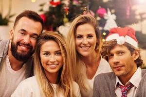 Group of friends having fun during Christmas photo