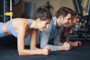 Group of people working out in a gym photo