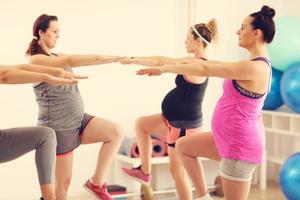 Group of pregnant women during fitness class photo