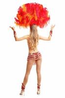 Brazilian woman posing in samba costume over white background photo