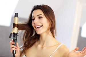 Young woman standing in bathroom in the morning photo