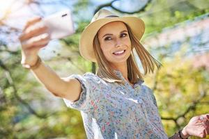 Woman with phone in the park. photo