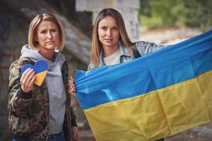 Two girls supports Ukraine with no war signs photo