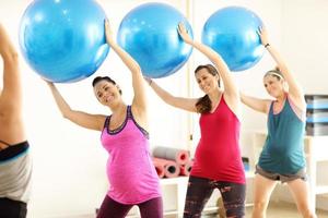 Group of pregnant women during fitness class photo