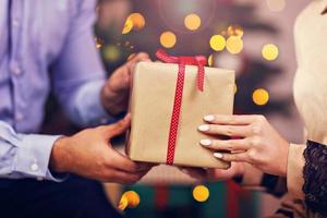 Happy Couple Opening Christmas Present photo