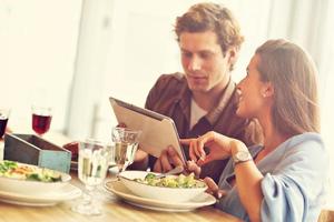 Cute couple on a date in restaurant photo