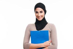 Muslim woman over white background photo