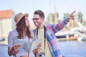 Adult happy tourists sightseeing Gdansk Poland in summer photo