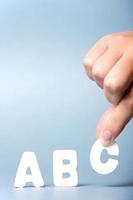Hand with ABC letter block photo