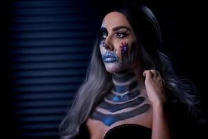 Spooky portrait of woman in halloween gotic makeup photo