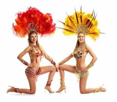 Brazilian women dancing samba over white background photo