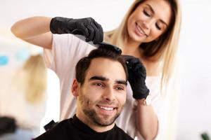 Adult man at the hair salon photo