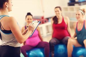 Group of pregnant women during fitness class photo