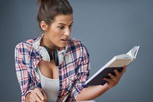 Female student learning at home photo