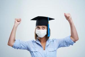 Student wearing protective mask isolated over white background photo