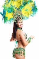 Brazilian woman posing in samba costume over white background photo