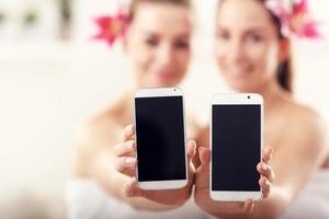 Two beautiful women in spa photo