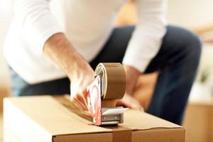 Happy adult couple moving out or in to new home photo