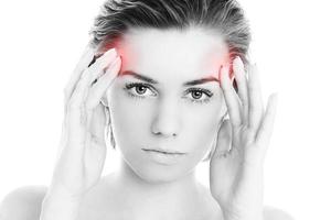 Woman suffering from migraine photo