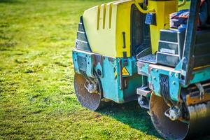 Picture of a road roller machine on the different surfaces photo