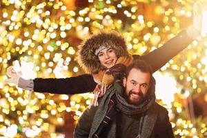 Adult couple hanging out in the city during Christmas time photo