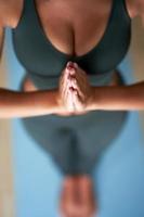 Adult woman practising yoga at home photo