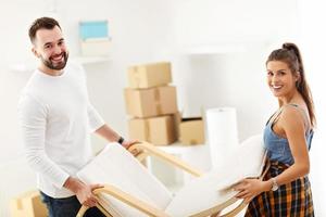 Happy adult couple moving out or in to new home photo