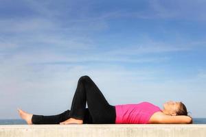 Young woman resting by the sea photo