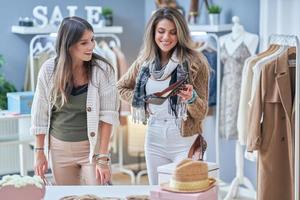 Group of happy friends during shopping photo