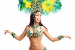 Brazilian woman posing in samba costume over white background photo