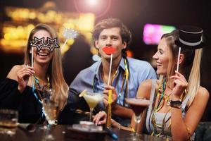 Group Of Friends Enjoying Drink in Bar photo