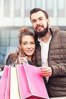 Young couple shopping in the city photo
