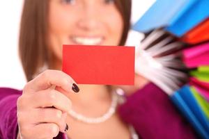 Brunette woman with blank business card photo