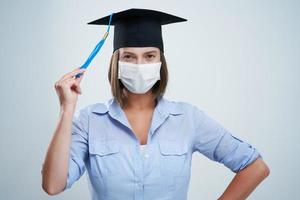 Student wearing protective mask isolated over white background photo