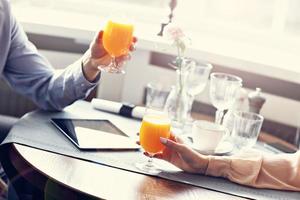 Two Businesspeople Meeting For Lunch In Restaurant photo