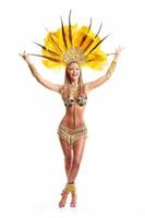 Brazilian woman posing in samba costume over white background photo