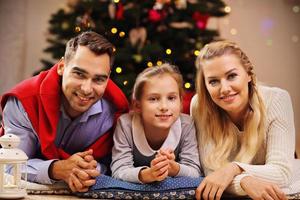 Happy family having fun during Christmas time photo