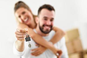 Happy adult couple moving out or in to new home photo