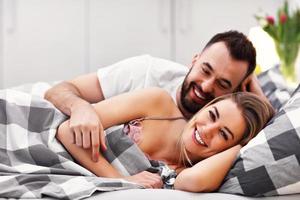 Adult attractive couple in bed photo