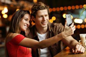 Cute couple on a date at the cafe photo