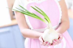 Big onion in hands photo