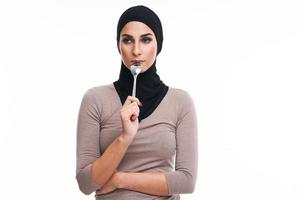 Muslim woman over white background photo