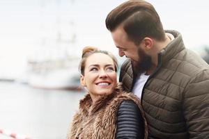 Young couple hugging outside photo