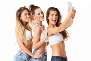 Group of happy friends posing in shorts photo