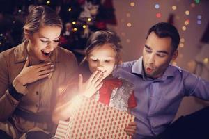 Happy Family Opening Christmas Present photo