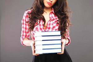 Sad woman with books photo