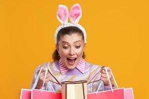 Studio shots of woman over yellow background easter style photo