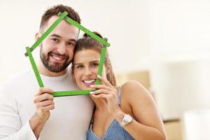 Happy adult couple moving out or in to new home photo