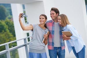 Group of students using smartphone in the campus photo
