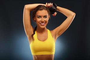 Fit woman stretching arms photo